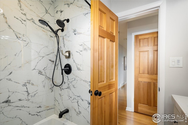 169 Emerald St, Broomfield, CO 80020 - full bathroom with washtub / shower combination and wood finished floors