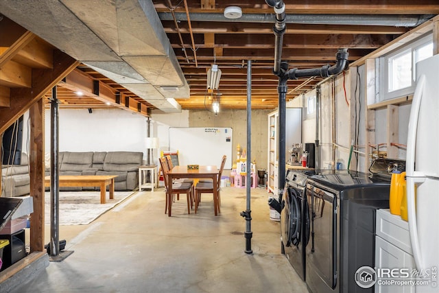 169 Emerald St, Broomfield, CO 80020 - below grade area featuring freestanding refrigerator and washing machine and clothes dryer
