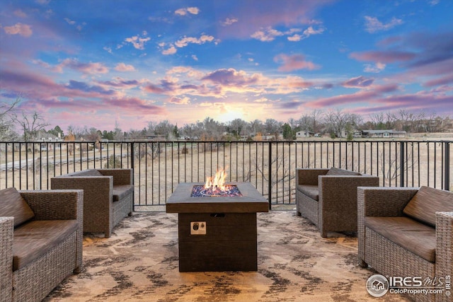 8568 Foxhaven Ct, Niwot, CO 80503 - patio terrace at dusk with an outdoor fire pit