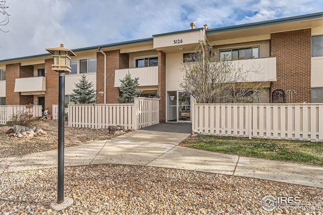 5126 Williams Fork Trl Unit 206, Boulder, CO 80301 - view of building exterior with fence