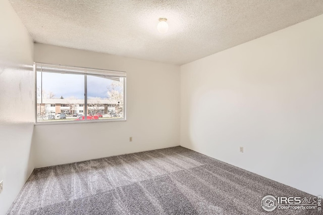 5126 Williams Fork Trl Unit 206, Boulder, CO 80301 - carpeted empty room featuring a textured ceiling