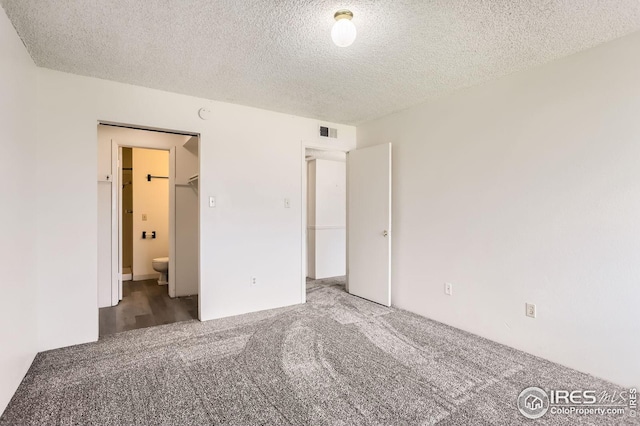 5126 Williams Fork Trl Unit 206, Boulder, CO 80301 - unfurnished bedroom featuring carpet flooring, a textured ceiling, and visible vents