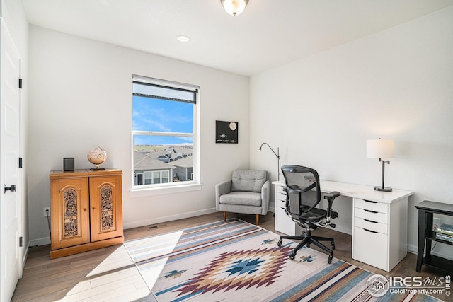 office space with recessed lighting, baseboards, and wood finished floors