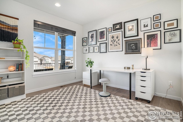 office area featuring recessed lighting, baseboards, and wood finished floors