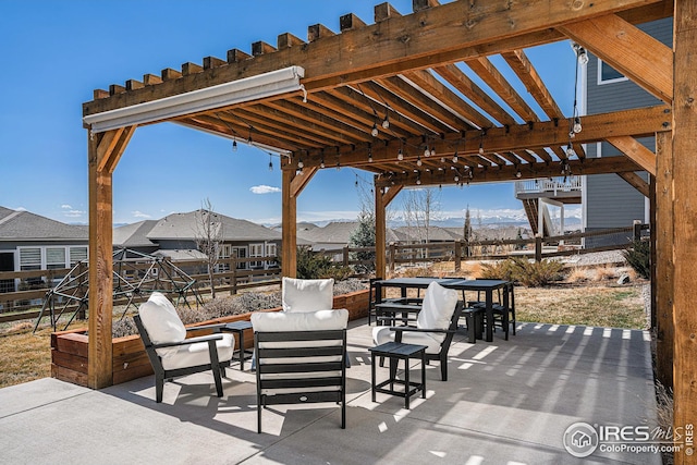 view of patio featuring an outdoor living space and fence