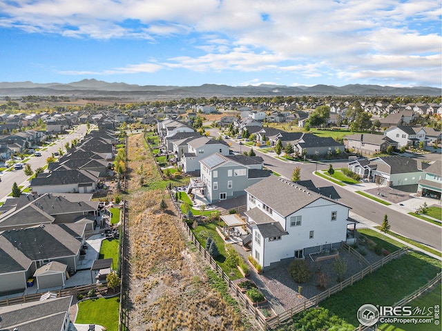 birds eye view of property with a residential view and a mountain view