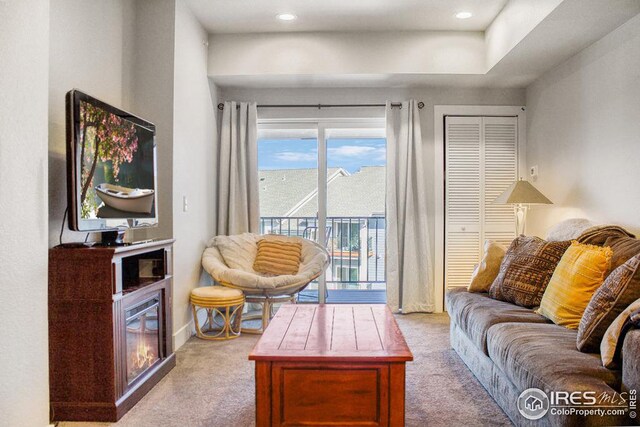 carpeted living room with recessed lighting