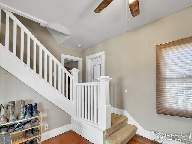 105 N Logan Ave, Haxtun, CO 80731 - staircase with baseboards, a ceiling fan, and wood finished floors