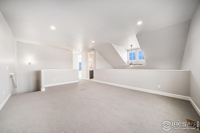 bonus room with baseboards, carpet floors, and recessed lighting