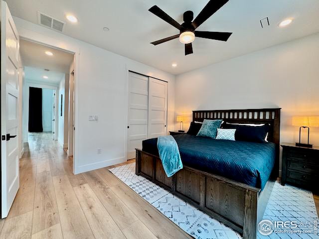 bedroom with baseboards, visible vents, light wood-style floors, and recessed lighting