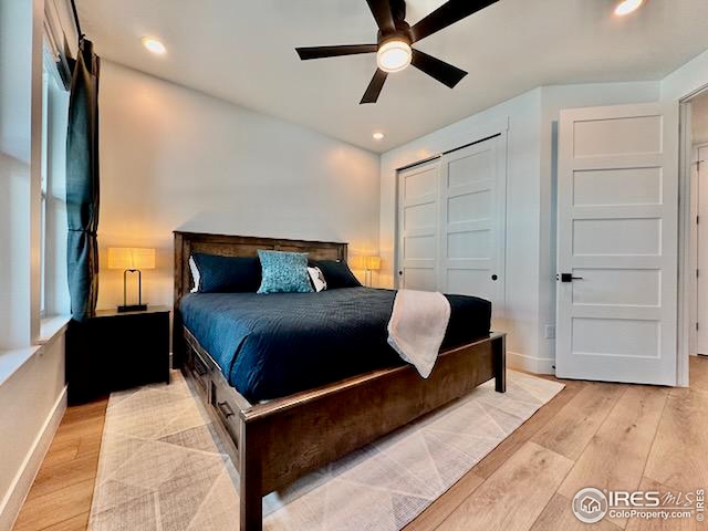 bedroom featuring baseboards, light wood finished floors, and recessed lighting