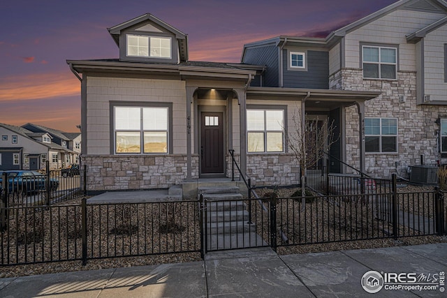 4191 Greenhorn Dr, Loveland, CO 80538 - multi unit property with central AC, stone siding, and a fenced front yard