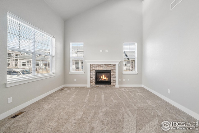 4191 Greenhorn Dr, Loveland, CO 80538 - unfurnished living room with carpet, baseboards, visible vents, and high vaulted ceiling
