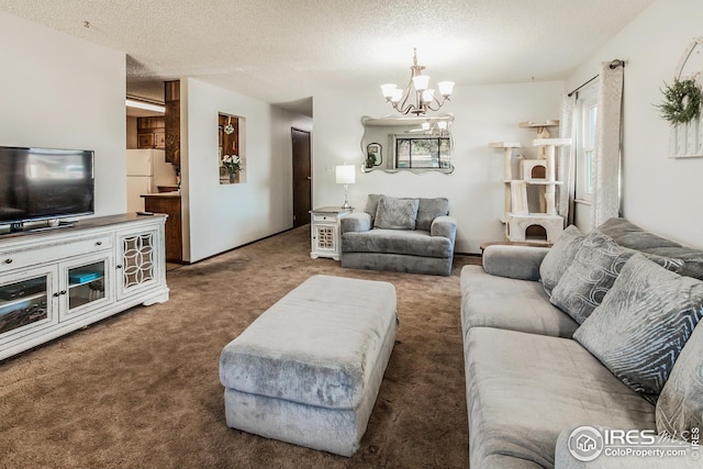 701 43rd Ave, Greeley, CO 80634 - living area featuring a notable chandelier, carpet, and a textured ceiling