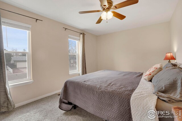 12901 E Idaho Dr, Aurora, CO 80012 - bedroom with baseboards, carpet floors, and a ceiling fan