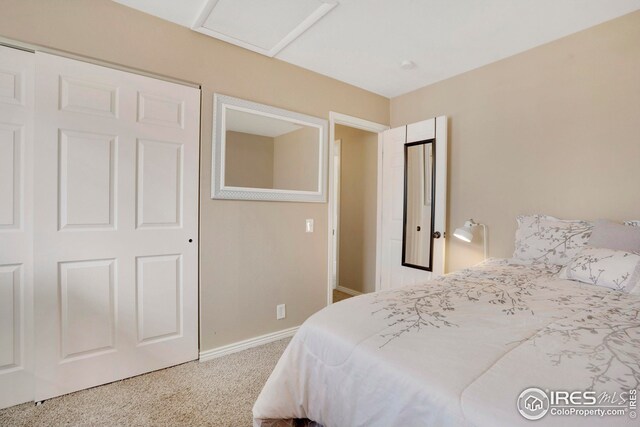12901 E Idaho Dr, Aurora, CO 80012 - carpeted bedroom featuring baseboards and attic access