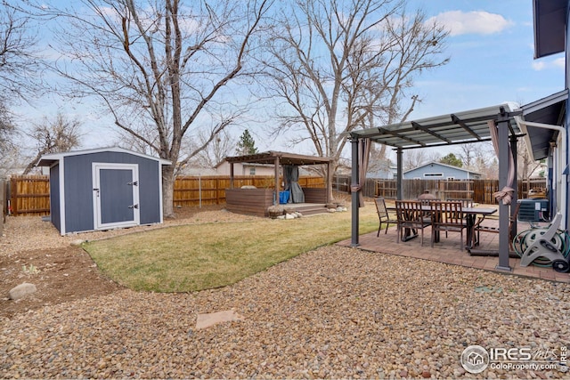 12901 E Idaho Dr, Aurora, CO 80012 - view of yard with a patio, an outbuilding, a fenced backyard, and a pergola