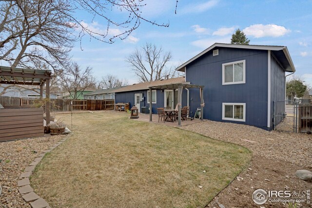 12901 E Idaho Dr, Aurora, CO 80012 - rear view of house featuring a fenced backyard, a pergola, a yard, and a patio area