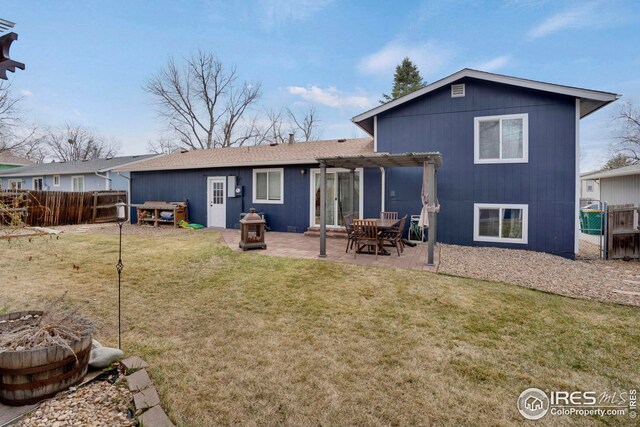 12901 E Idaho Dr, Aurora, CO 80012 - rear view of house featuring a lawn, fence, an outdoor fire pit, and a pergola