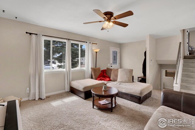 12901 E Idaho Dr, Aurora, CO 80012 - carpeted living area featuring stairs, baseboards, and a ceiling fan