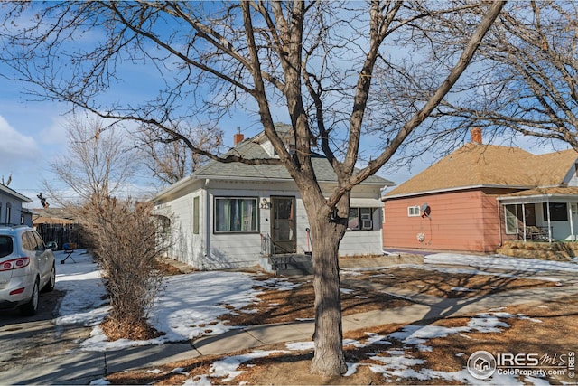 919 State St, Fort Morgan, CO 80701 - view of front facade with a chimney