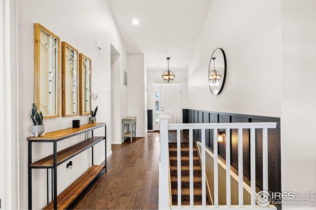 corridor featuring dark wood finished floors and recessed lighting