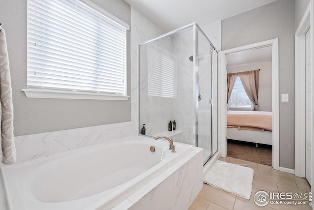 bathroom with tile patterned floors, a marble finish shower, ensuite bathroom, and a bath