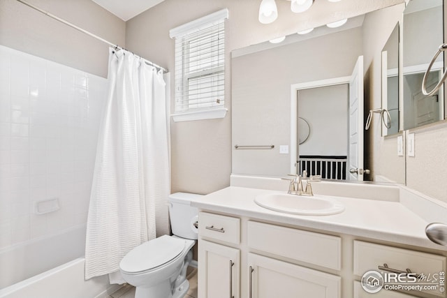 bathroom featuring toilet, vanity, and shower / bathtub combination with curtain