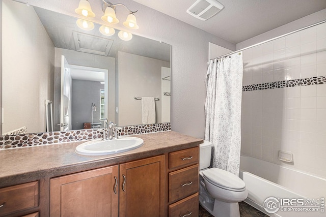 full bathroom featuring toilet, vanity, shower / bathtub combination with curtain, visible vents, and a textured wall