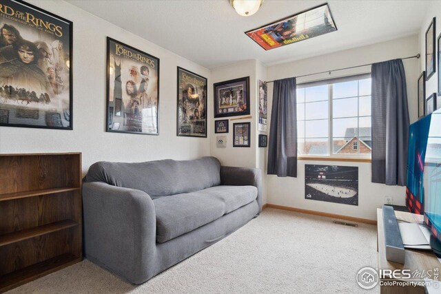 1725 67th Ave, Greeley, CO 80634 - living room featuring carpet, baseboards, and visible vents
