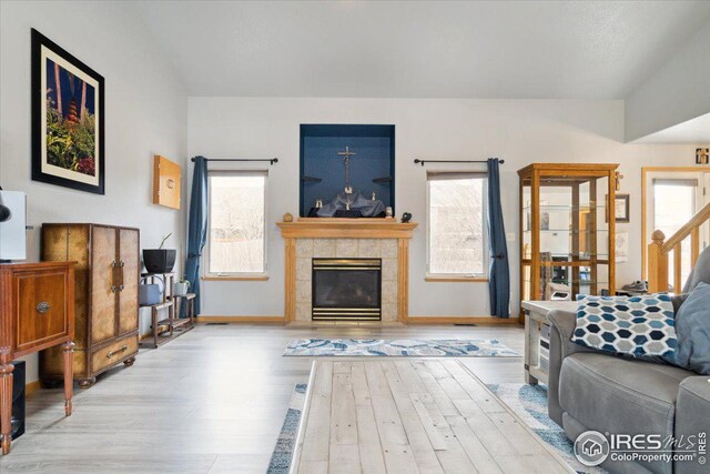 1725 67th Ave, Greeley, CO 80634 - living room with baseboards, wood finished floors, and a tile fireplace