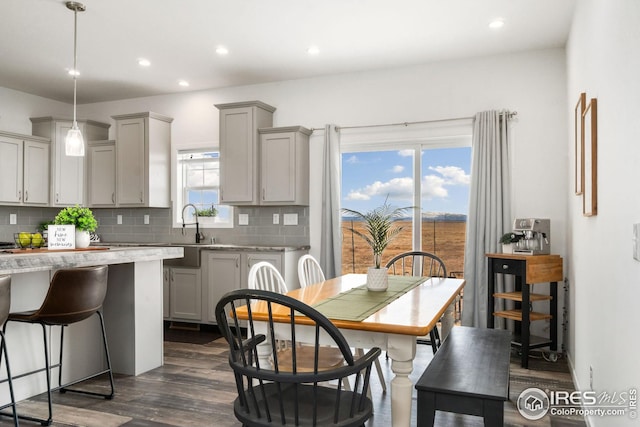 dining room with dark wood-style floors and recessed lighting