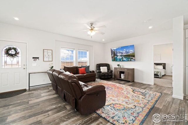 living room with baseboards, wood finished floors, recessed lighting, and a ceiling fan