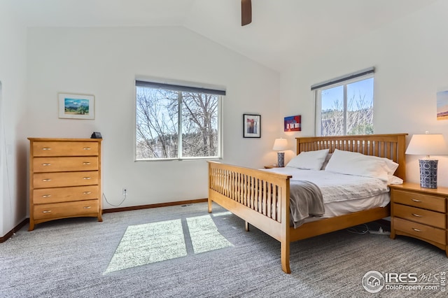bedroom featuring baseboards, vaulted ceiling, carpet flooring, and a ceiling fan