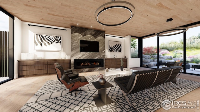 interior space featuring a fireplace, wood finished floors, expansive windows, and wooden ceiling