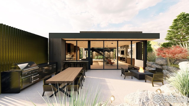 view of patio / terrace featuring exterior kitchen, an outdoor fire pit, and a grill
