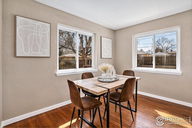 191 Emerald St, Broomfield, CO 80020 - dining space featuring plenty of natural light, baseboards, and wood finished floors