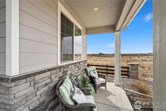 view of patio / terrace featuring fence