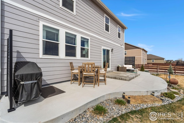 view of patio / terrace featuring grilling area, an outdoor hangout area, and fence