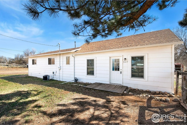 back of house featuring central AC