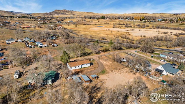 aerial overview of property's location with rural landscape and mountains