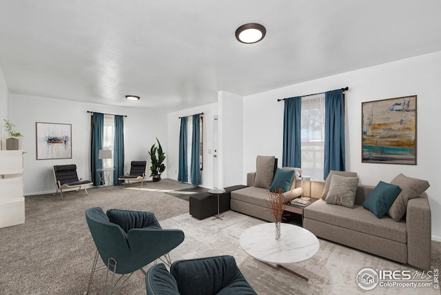 living room with carpet flooring and baseboards