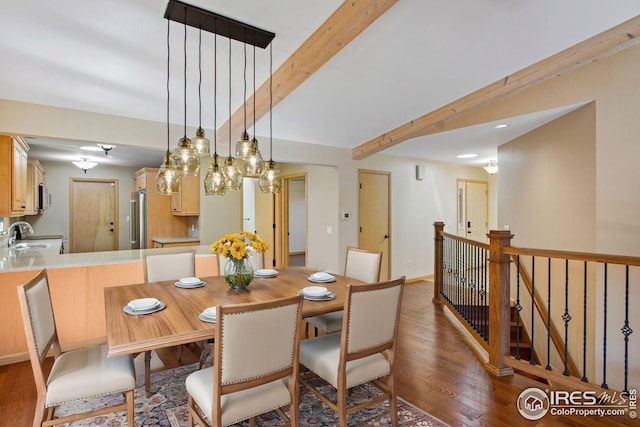 1132 Fairway Club Ln Unit 2, Estes Park, CO 80517 - dining room with wood finished floors and beamed ceiling