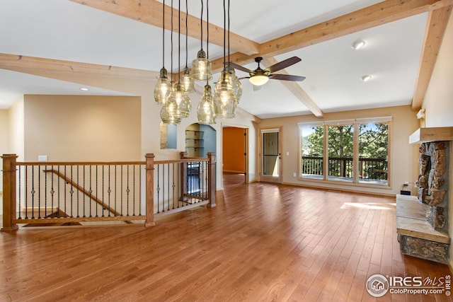 1132 Fairway Club Ln Unit 2, Estes Park, CO 80517 - unfurnished living room with wood finished floors, ceiling fan, a fireplace, baseboards, and recessed lighting