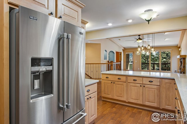 1132 Fairway Club Ln Unit 2, Estes Park, CO 80517 - kitchen with high end fridge, dark wood-style floors, a peninsula, ceiling fan, and decorative light fixtures