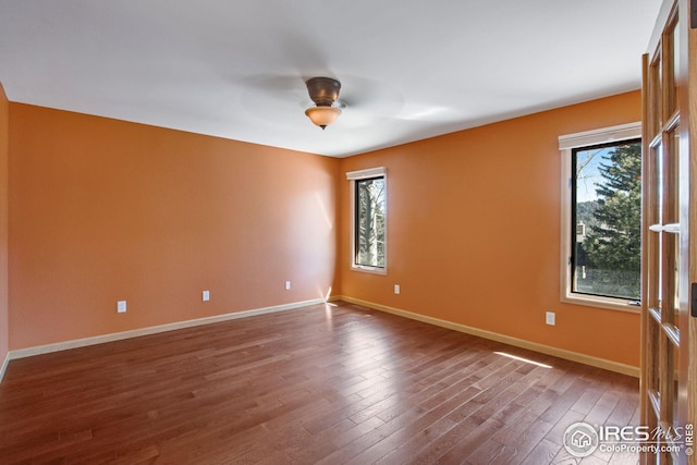 1132 Fairway Club Ln Unit 2, Estes Park, CO 80517 - spare room with plenty of natural light, dark wood-style floors, baseboards, and ceiling fan