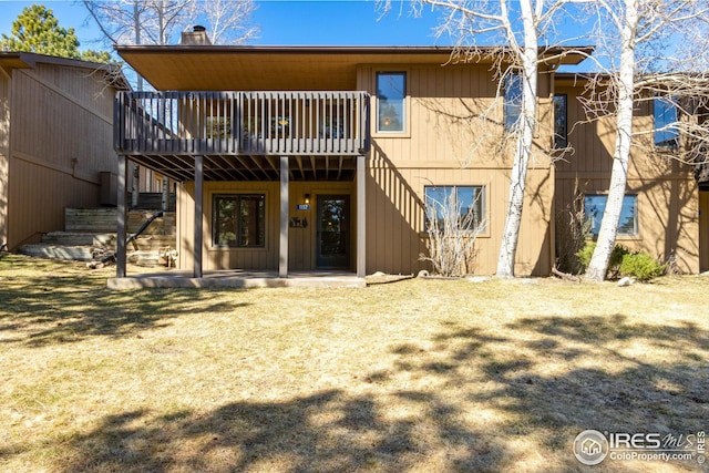 1132 Fairway Club Ln Unit 2, Estes Park, CO 80517 - back of property featuring a wooden deck and a chimney