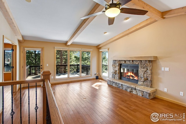 1132 Fairway Club Ln Unit 2, Estes Park, CO 80517 - unfurnished living room with a fireplace, wood finished floors, ceiling fan, and baseboards