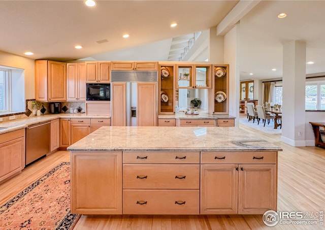 kitchen featuring built in appliances, light brown cabinetry, light wood-style flooring, and recessed lighting