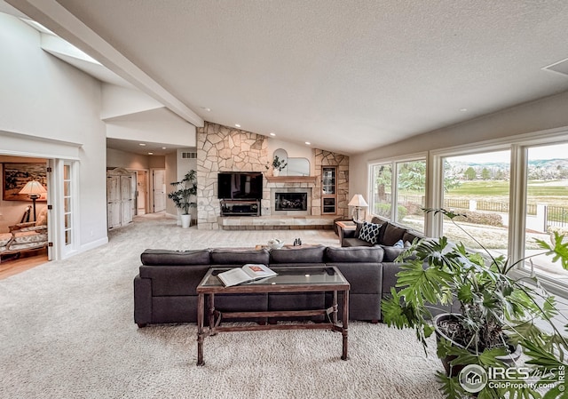 living room with vaulted ceiling, carpet flooring, a fireplace, recessed lighting, and a textured ceiling